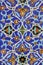 Colorful mosaic and ceramic tiles in the traditional Persian style on the wall of the Jameh Mosque of Isfahan, Iran