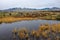 Colorful mountain landscape with autumn colors and icy lake