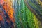 Colorful multicolored paint covered with water drops, theme wallpaper background. Selective focus. Multicolor