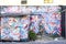 Colorful mural painting with graffiti in a favela at Dois Irmaos mountains in Rio de Janeiro, Brazil