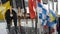 Colorful nautical sailing flags flying in the wind from the lines of a sailboat mast backlit