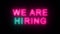 Colorful neon inscription we are hiring.