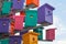 Colorful nesting boxes on blue sky