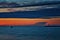 Colorful night scene on the Baltic Sea with lighthouse and ship in SwinemÃ¼nde. Swinoujscie, Poland