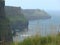 Colorful ocean views, green grassy rocks, rocks and blue water