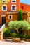 Colorful ochre houses and garden in the Roussillon village, Provence, France