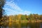 Colorful october with colorful yellow trees in the autumn with reflection in the water