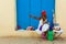 Colorful old black lady with a fine cuban cigar