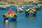 Colorful, old fisher boats are parking in harbor of Marsaxlokk, Malta