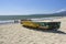 Colorful old fishing boat on the beach.