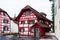 Colorful old wooden building in Lucerne Switzerland with exposed red wood overcast day