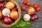 colorful onions basket on wood