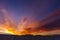 Colorful orange and blue dramatic sky with clouds.