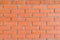 Colorful orange brick wall background in a Flemish stretcher bond pattern.Wide brick wall panoramic texture. Home and