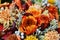 Colorful orange flowery bouquet background, close up