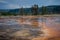 Colorful orange hot spring geothermal area inside of Yellowstone National Park