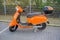 Colorful orange scoot for rent,