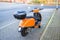 Colorful orange scoot for rent,