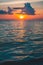 colorful orange sunset and ocean wave and cloudy sky in beautiful summer day. sunset image edited with little grain and dramatic s
