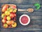 Colorful Organic Tomatoes in wooden plate with ketchup spices an
