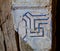 Colorful ornamental tiles at moroccan courtyard swastika