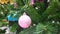 Colorful ornaments decorate on a Christmas tree. greeting season video background