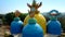 Colorful pagoda domes with hands against bright sunlight