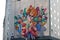 Colorful paint graffiti with woman flowers birds butterflies scene