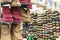 Colorful painted boots and warm boots hanging for sale at the fair