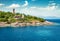 Colorful panoramic view of old Venetian lighthouse. Slpendid morning seascape of Ionian Sea. Wonderful outdoor scene of Kefalonia