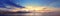 Colorful panoramic view of Sicily coastline with cloudy sunset sky