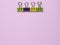 Colorful paper clip on pink millennial background. Space to insert the text.