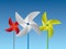 Colorful paper pinwheels arrange in a row vector illustration on blue background for childhood game