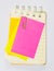 Colorful paperclips ,post it and note book on white background i