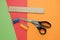 Colorful papers, scissors, pencil sharpener, ruler