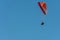 colorful paraglider flying with blue sky