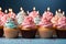 Colorful pastel birthday cupcakes on a pastel background. Generative Ai