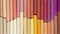 Colorful pastel crayons in warm colors in two rows as background