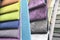 Colorful patterns of upholstery fabric. Close-up of samples of furniture fabric. Multicolored soft velour. Furniture industry. Bac