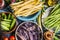 Colorful pea and bean pods in bowls, top view, close up. Healthy vegetarian food