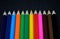 Colorful pencils collection on black background