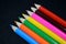 Colorful pencils collection on black background