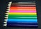 Colorful pencils collection on black background