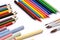 Colorful pencils, crayons, chalks and paintbrushes