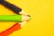 Colorful pencils isolated on yellow. drawing supplies