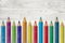 Colorful Pencils Painted Over Whitewashed Boards