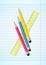 Colorful pencils and ruler on ruled paper