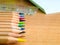 Colorful pencils on a writing desk.