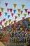 Colorful pennants on ropes hanging on house facades