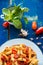 Colorful penne pasta with tomatoes